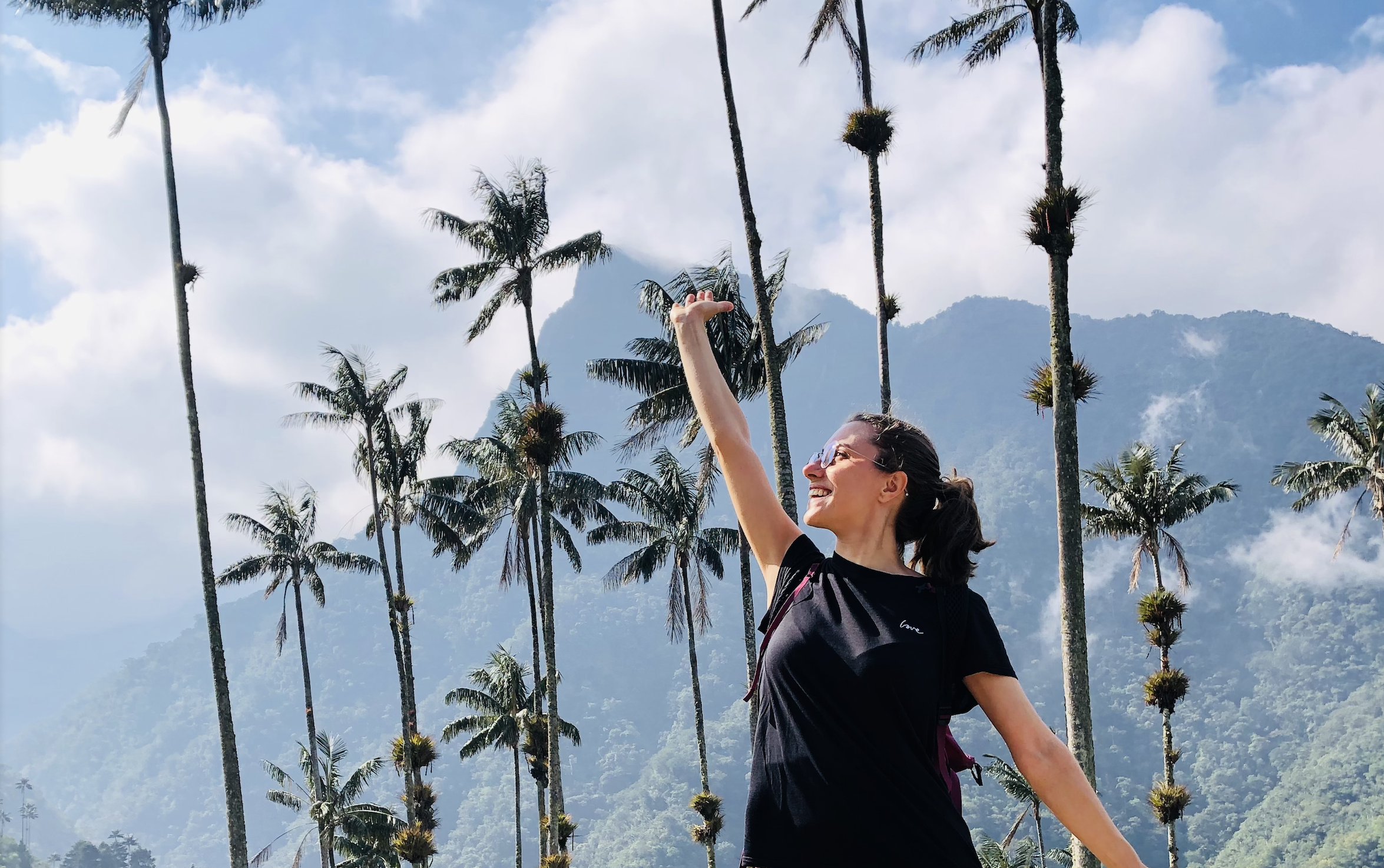 Photo with palm trees in Cocora Valley, building confidence with solo travel