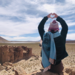 Heart shape hands for Bolivia travel landscape