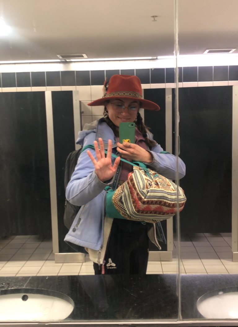 At the airport for my final flight home, realizing solo travel builds confidence